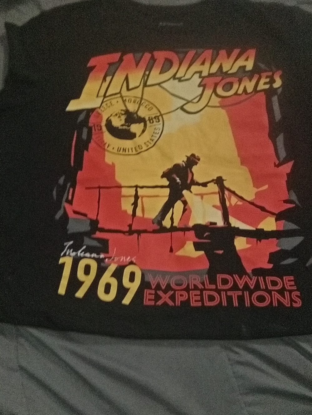 Indiana Jones Black Tee with Red & Yellow Expedition Graphic